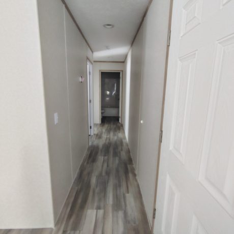 A home hallway with a door visible.