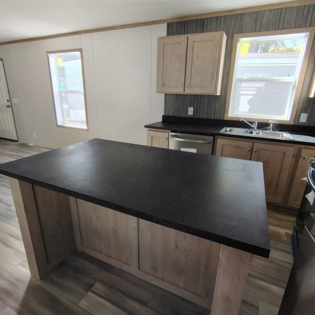 A modern kitchen featuring a sleek black countertop.